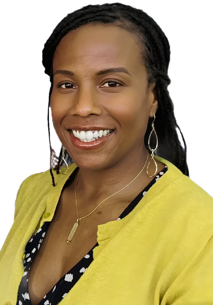 Dr. La Wanda Knox smiling in a mustard cardigan